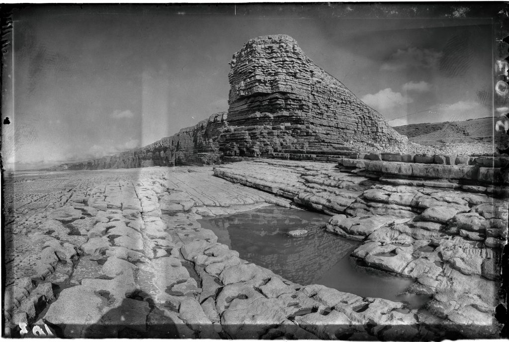 200 million year old Jurassic limestone formations with tidal pool, Nash Point, Vale of Glamorgan